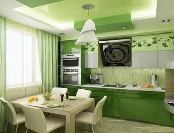 Вариант зеленой кухни с белым столом